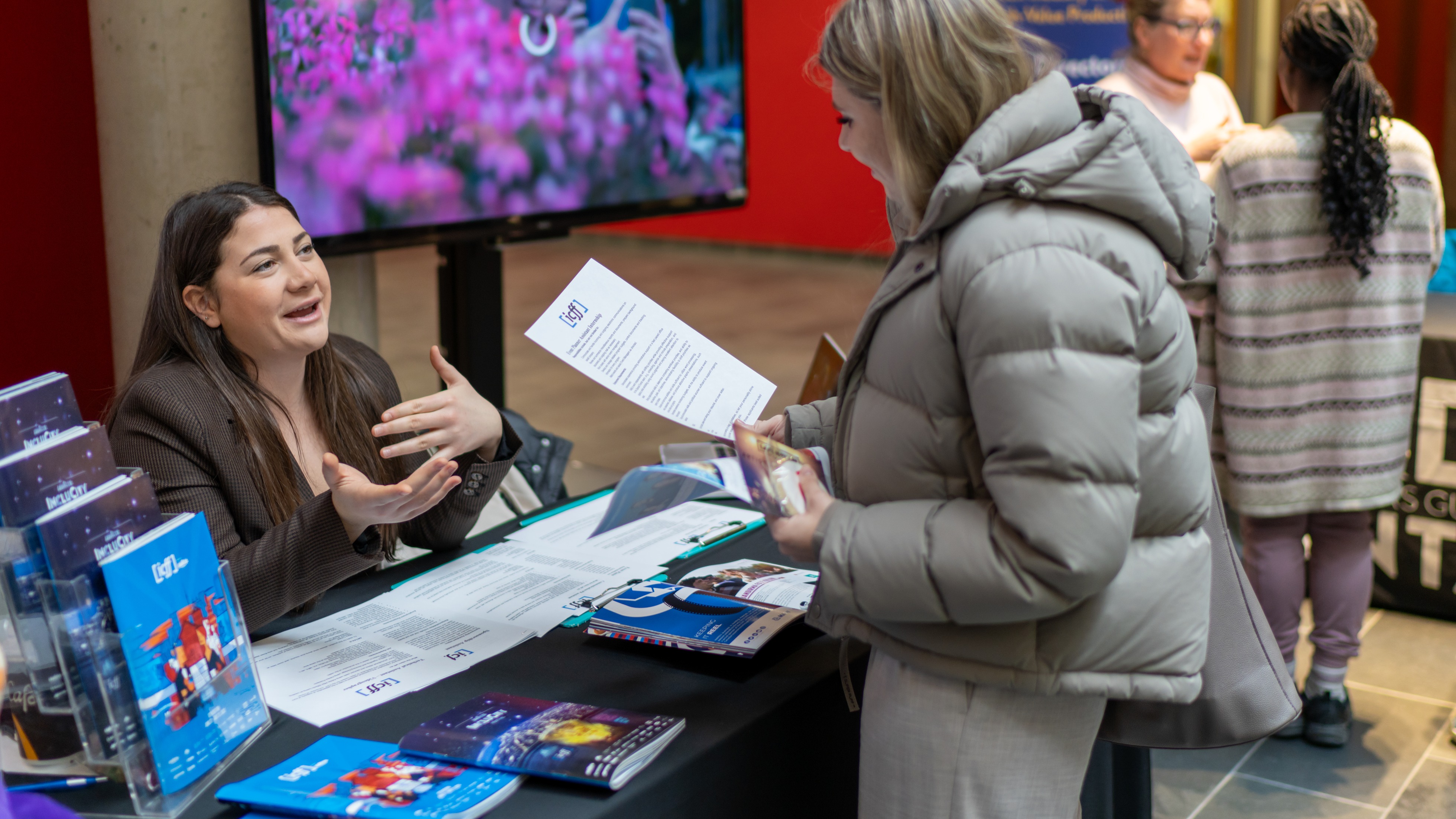 Student speaking to an employer partner at a career fair