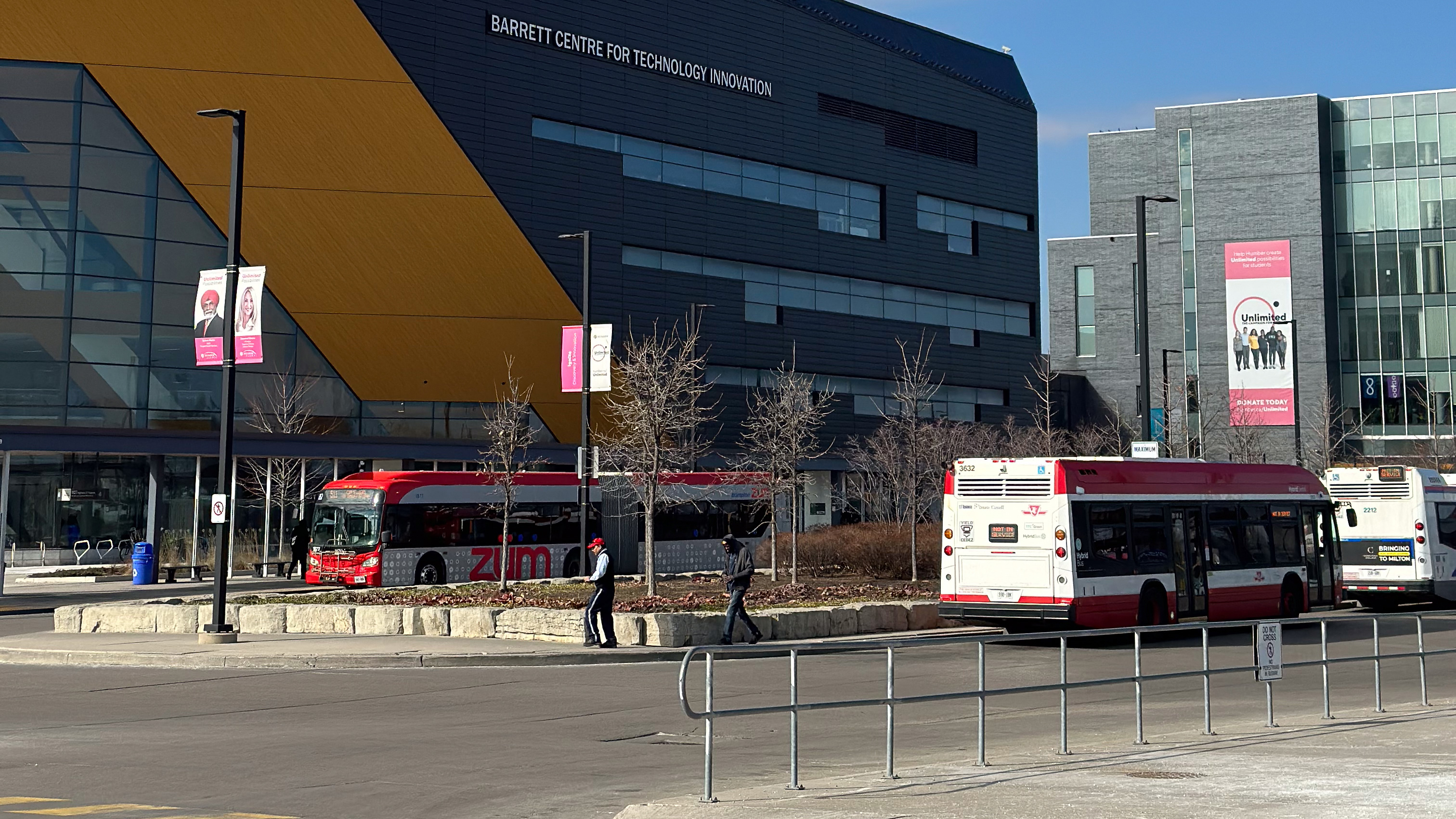 Bus loop outside the Barrett Centre for Technology and Innovation with two buses