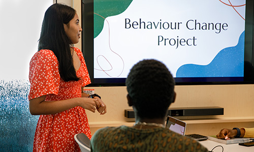 Behaviour Change Project presentation female student presenting a behaviour change project to male student