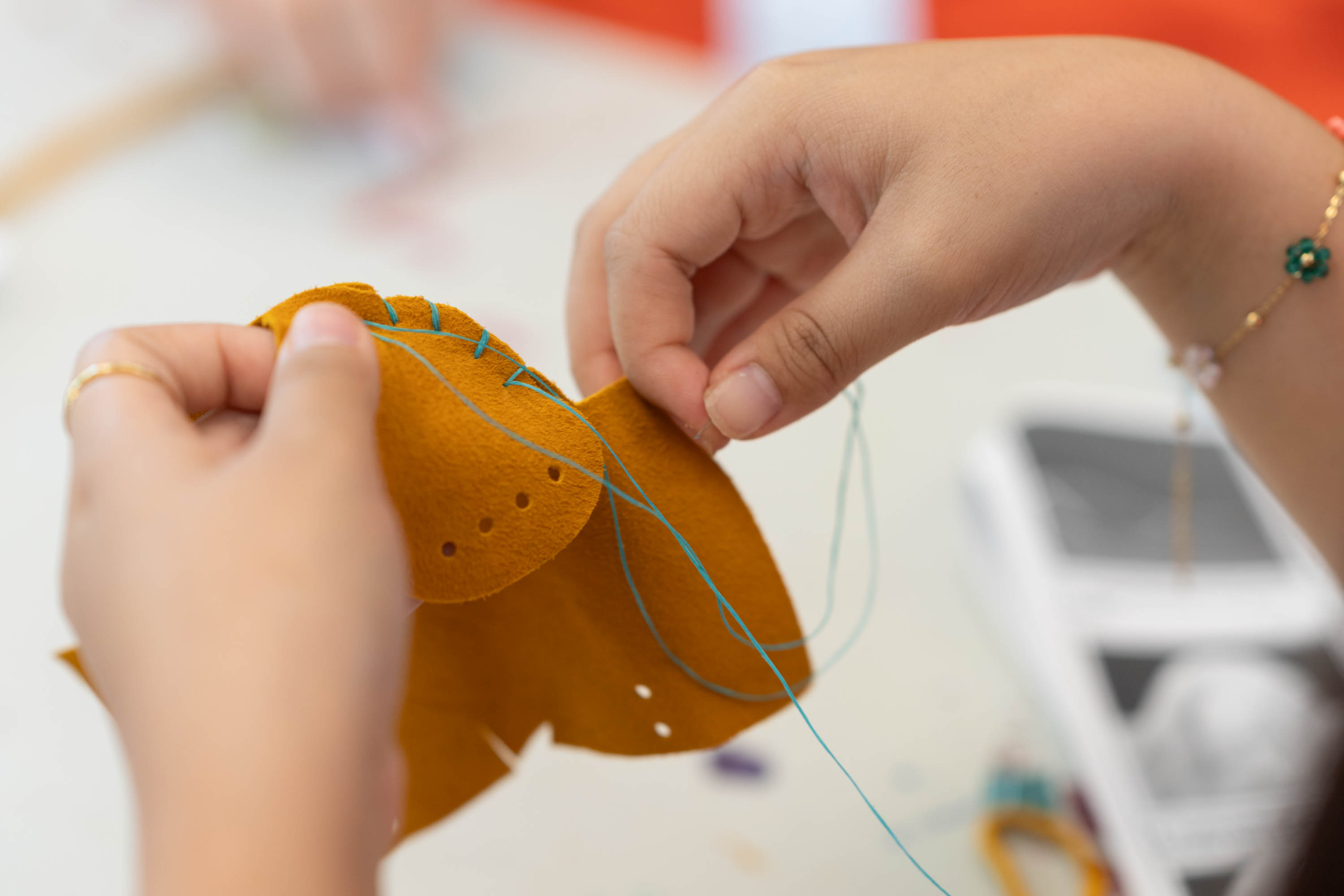 Person making traditional Indigenous moccasins