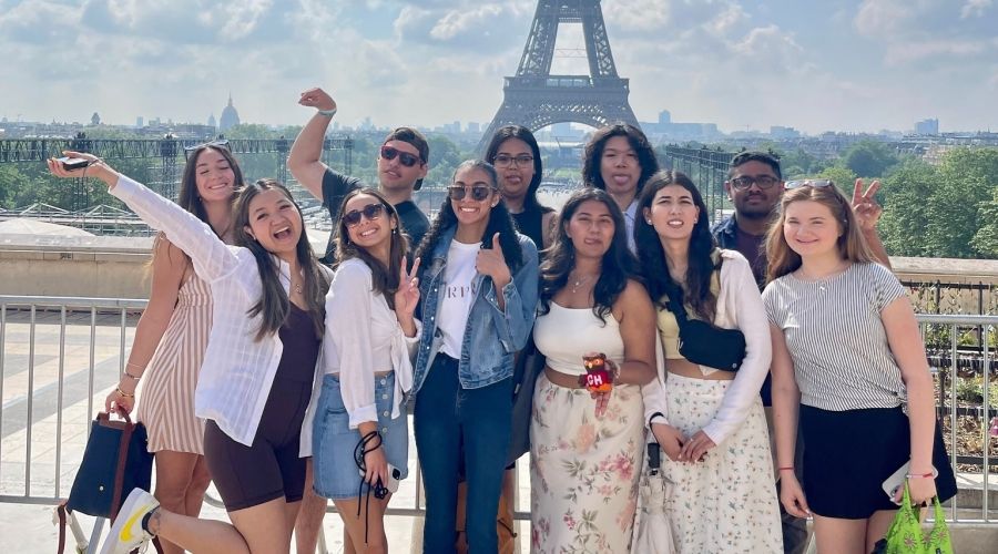 A group of students with the Eiffel Tower in the background